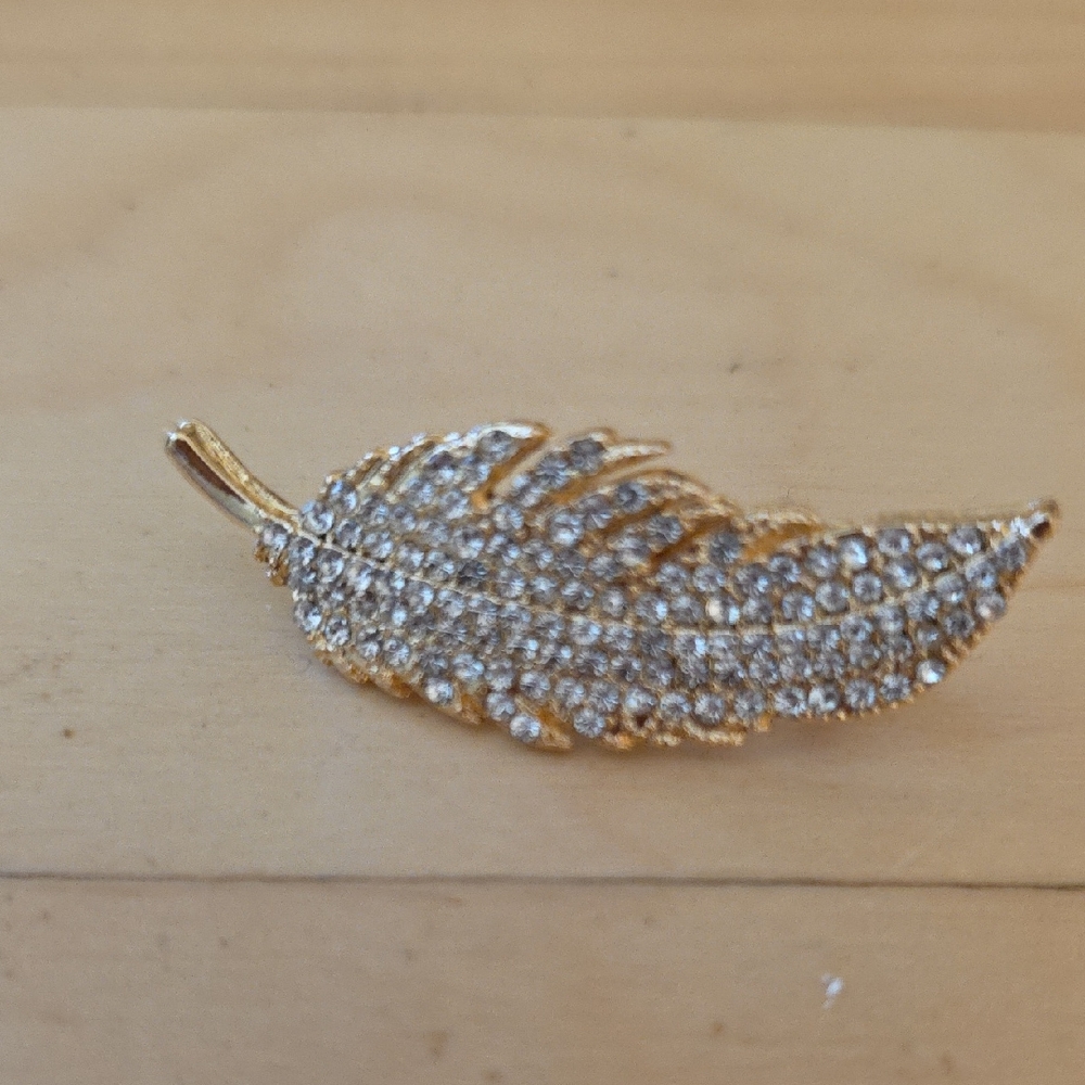 Elegant Gold and Silver Feather Brooch